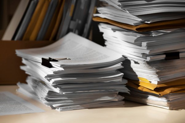 still-life-documents-stack-1-602×400